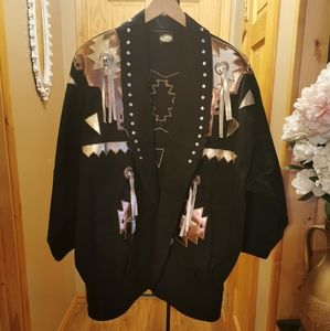 A Unique Western Jacket with padded attached and a beautiful rhinestone design.